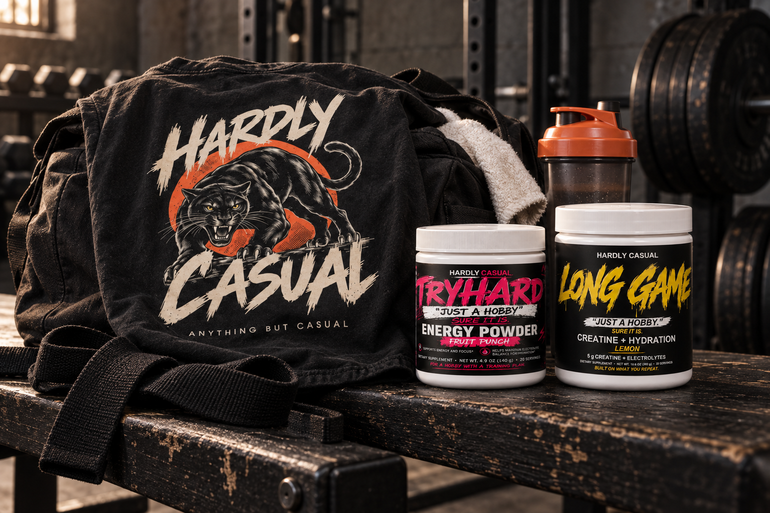 HardlyCasual gym kit with Panther tee, TRYHARD energy powder, and LONG GAME creatine